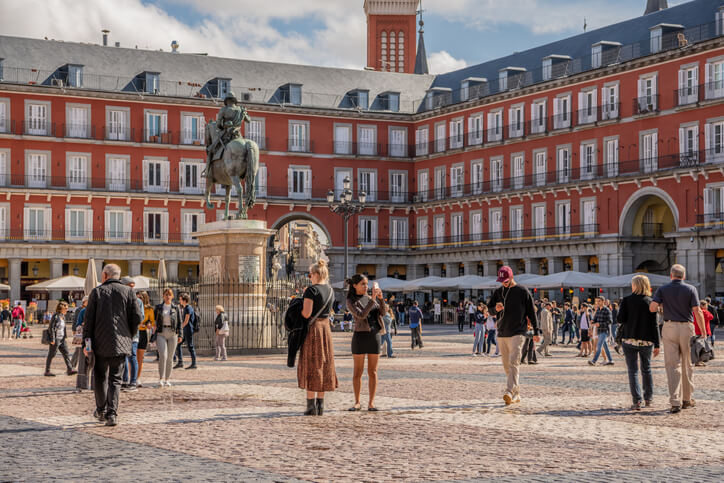 People explore historical Plaza Mayor in central Madrid